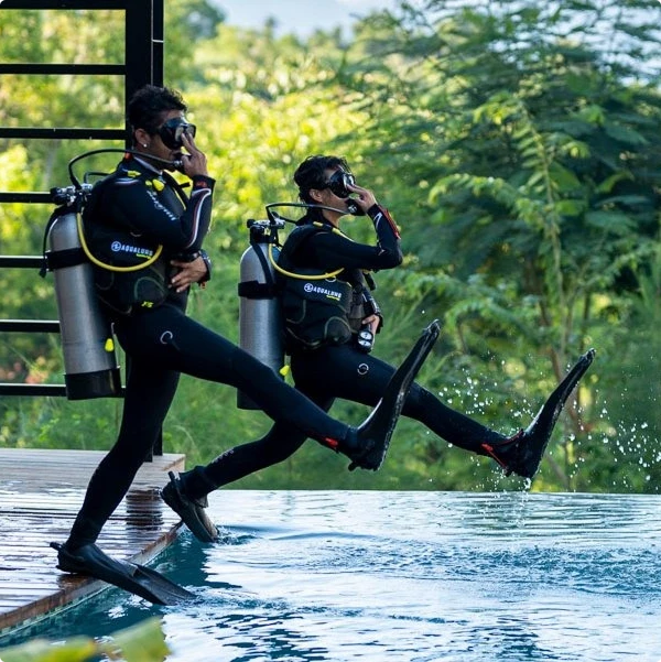 Divers practising a pool entry at Deep Roots