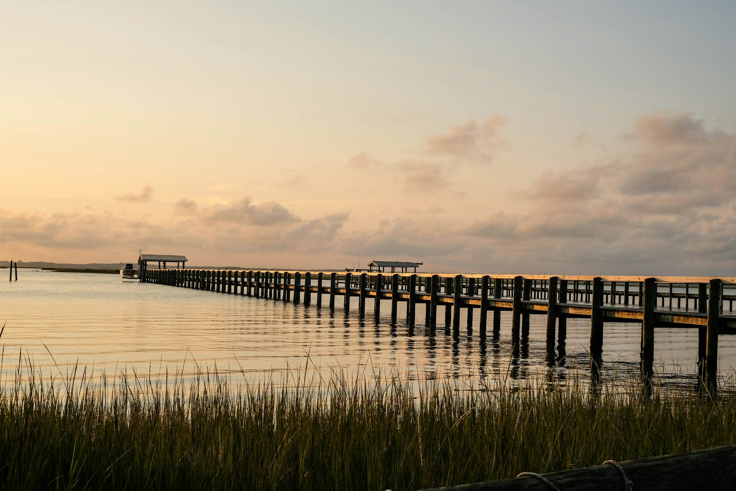 The long pier over the marsh at sunset