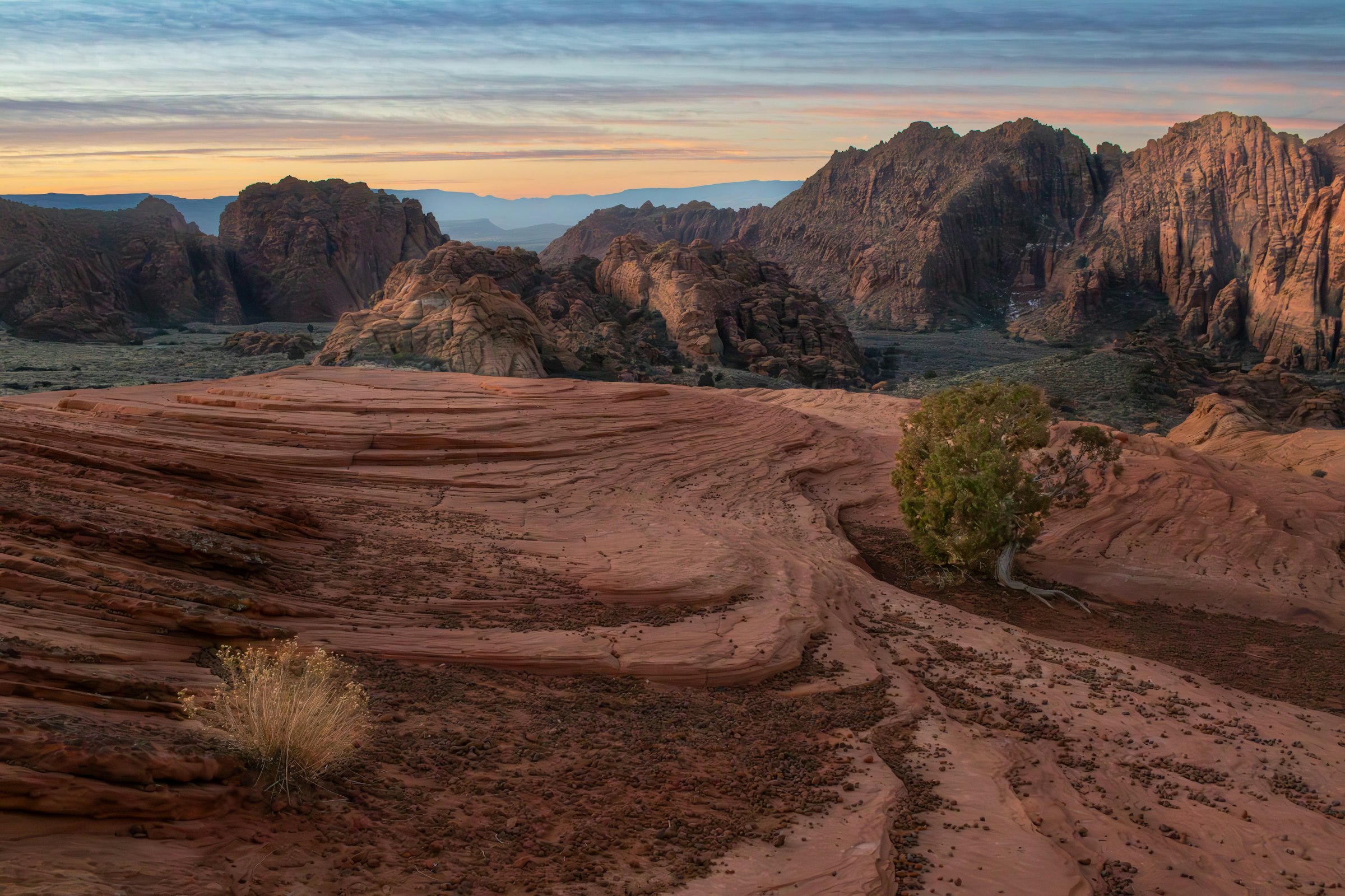 A red sand wash below the rock fins