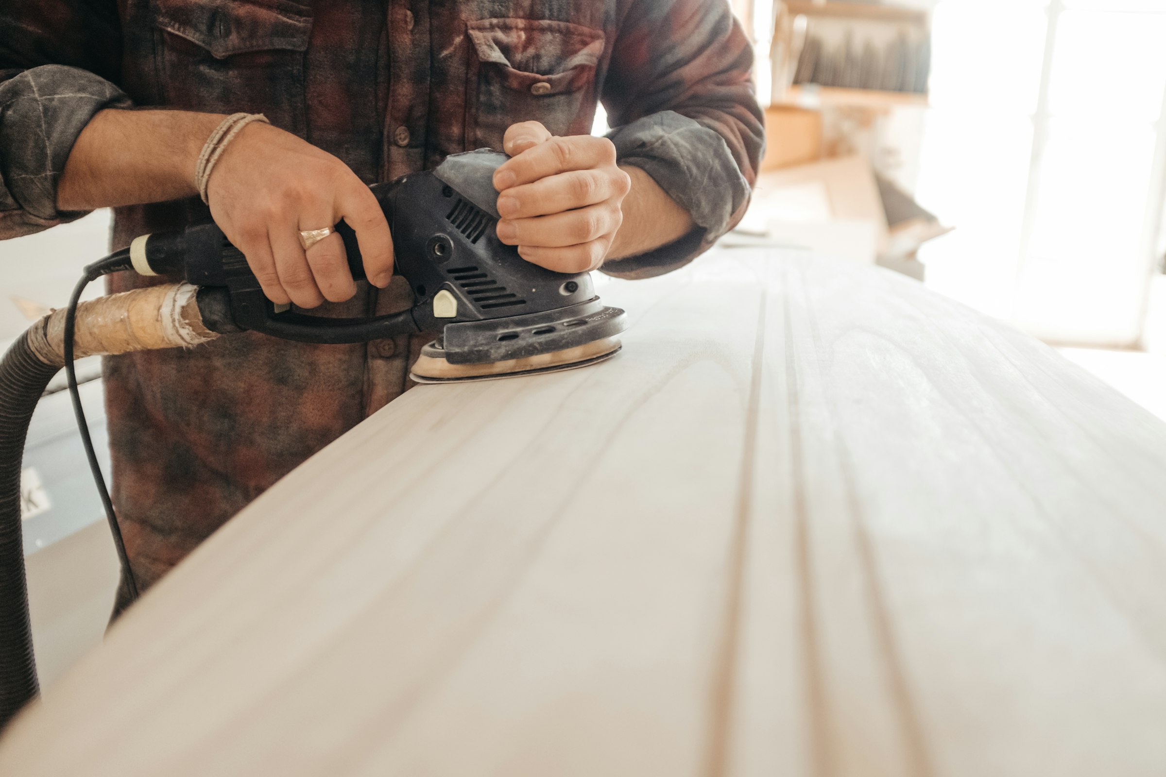 Sanding a repair smooth in the back room